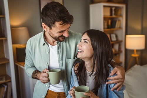 Husband And Wife Drinking Coffee