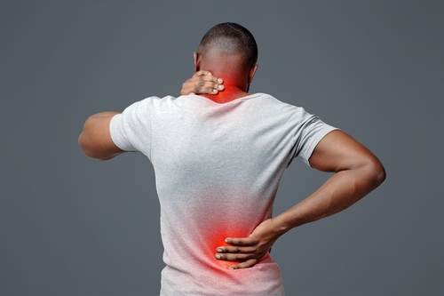 man with neck and back pain