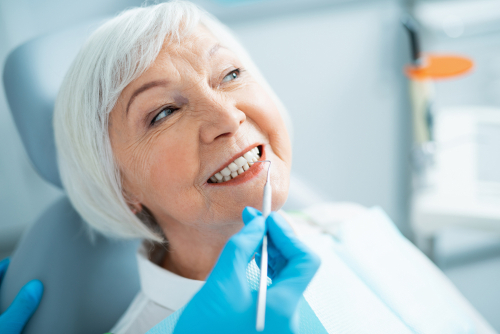 older woman getting a teeth cleaning