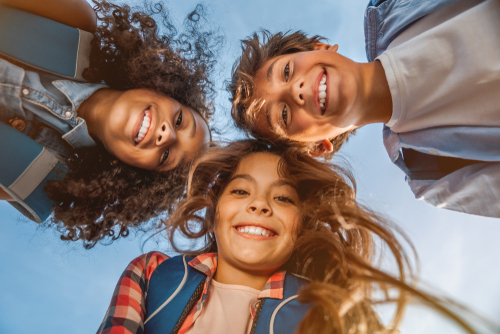 three kids smiling