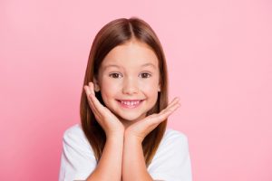 a little girl smiling